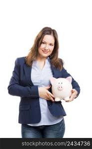 Business woman holding a piggy bank, isolated over white background