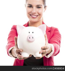 Business woman holding a piggy bank on the hands, isolated over a white background