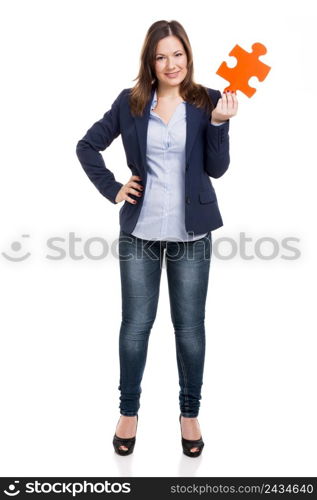 Business woman holding a puzzle piece, isolated over white