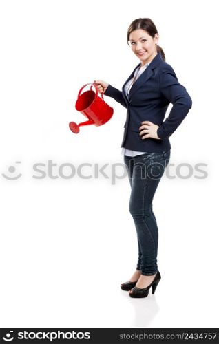 Business woman holding a water can, isolated over white background