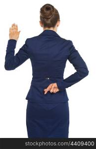 Business woman holding crossed fingers behind back while oath truth . rear view