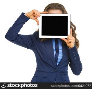 Business woman holding tablet pc with blank screen in front of face