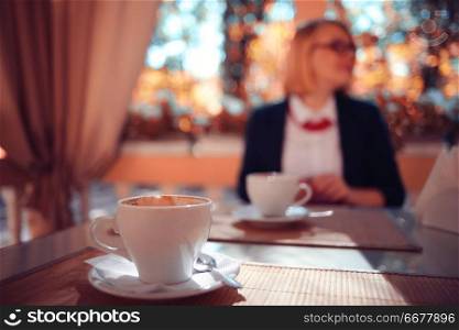 business woman in a cafe