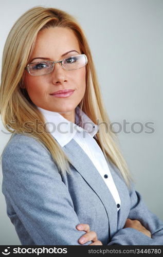 business woman in glasses on gray background