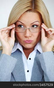 business woman in glasses on gray background