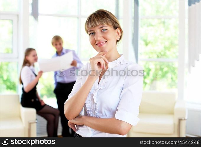 business woman in office and collegues on background