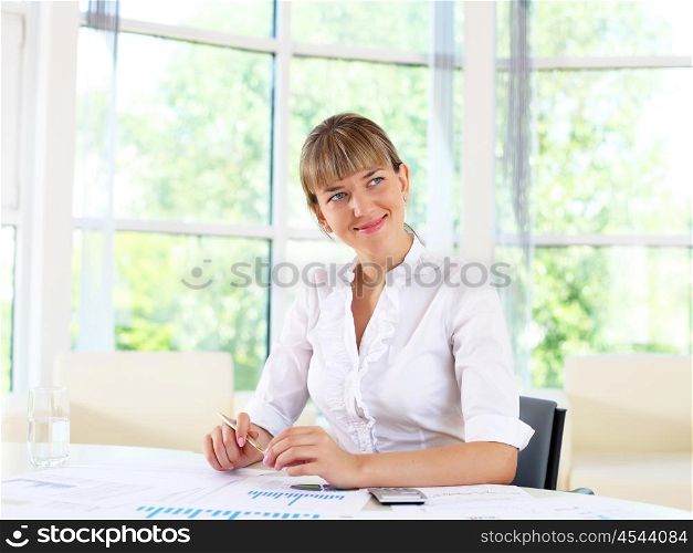 business woman in office working with papers