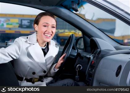 business woman is laughing in her car