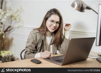 Business woman is working in her office desk