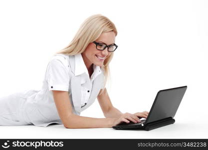 business woman lies and working on laptop