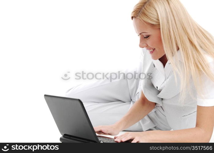 business woman lies and working on laptop