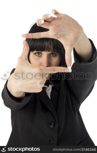 Business woman looking through fingers.