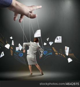 Business woman marionette. Businesswoman marionette on ropes controlled by puppeteer against diagram picture