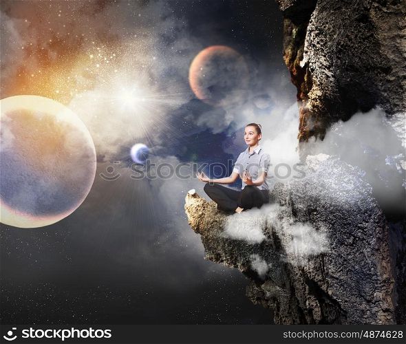 business woman meditating. Businesswoman sitting in lotus flower position against space background