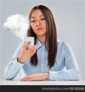 Business woman on hot line. Businesswoman calling phone and vapor appearing from it