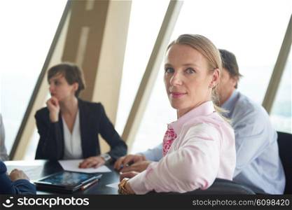 business woman on meeting, people group in background at modern bright office indoors