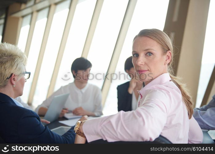 business woman on meeting, people group in background at modern bright office indoors