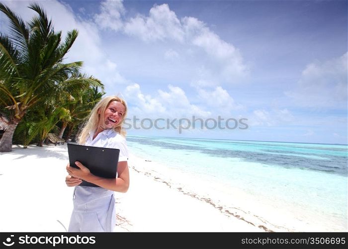 business woman on ocean coast on the background of a palm trees and sky and sea