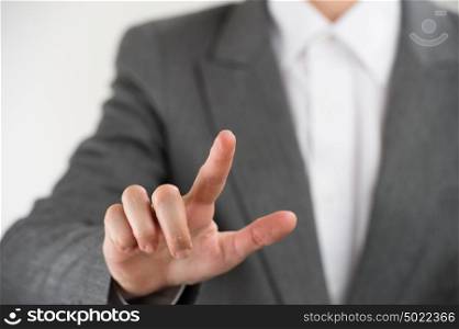 Business woman pointing her finger on imaginary virtual button