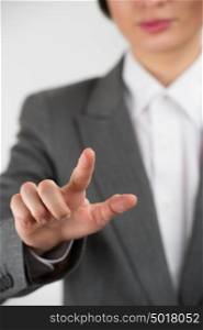 Business woman pointing her finger on imaginery virtual button