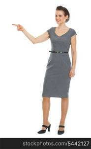 Business woman pointing in corner