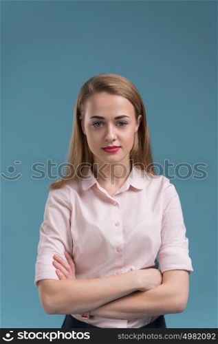 Business woman portrait on blue background