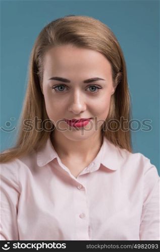 Business woman portrait on blue background