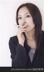 business woman posing with cigarrette
