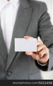 Business woman showing her blank business card