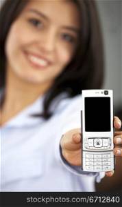 business woman showing her new phone smiling in an office