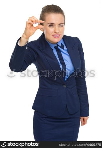 Business woman showing small risks gesture