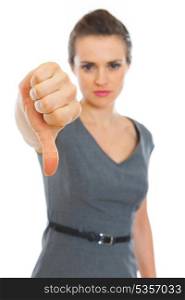 Business woman showing thumbs down. Focus on hand. Business woman showing thumbs down