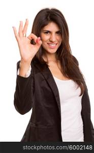 Business woman signaling ok - isolated over white