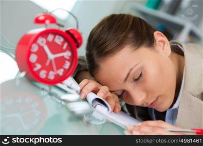 business woman sleeping at the desk in work