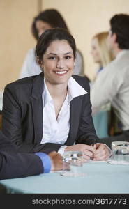Business woman smiling in conference, portrait