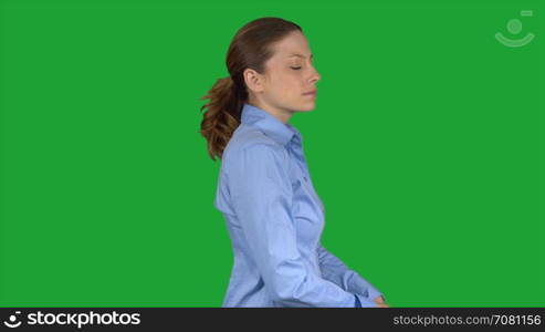 Business woman smirks and poses (Green Key)