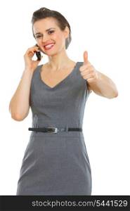 Business woman speaking cellphone and showing thumbs up