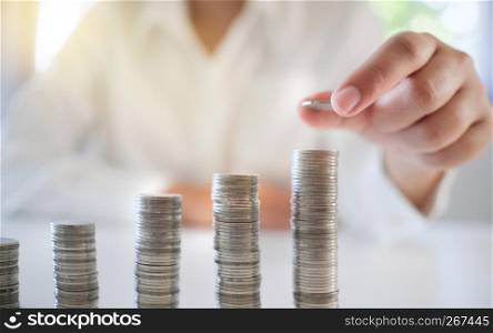 business woman stacking money coins, investment and banking concept