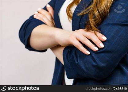 Business woman standing with folded arms. Woman standing with folded arms