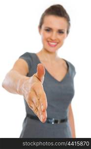 Business woman streching hand for handshake.Focus on hand. Business woman streching hand for handshake