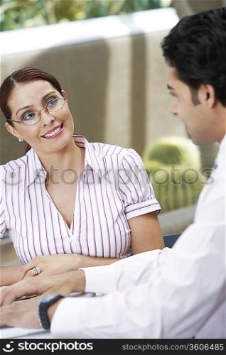Business woman talking to colleague