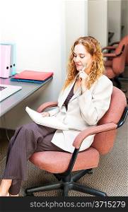 Business woman thinking at office desk