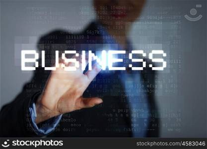 Business woman touching display. Business woman touching virtual display. Business and technology concept