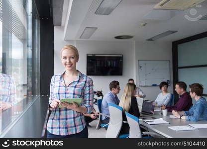 Business Woman Using Digital Tablet in corporate office by window