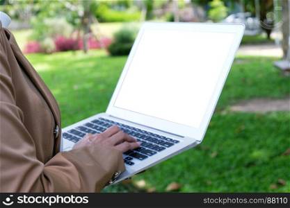 Business woman using laptop computer.works online on laptop which hand on keyboard