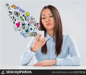 Business woman using mobile technology to communicate