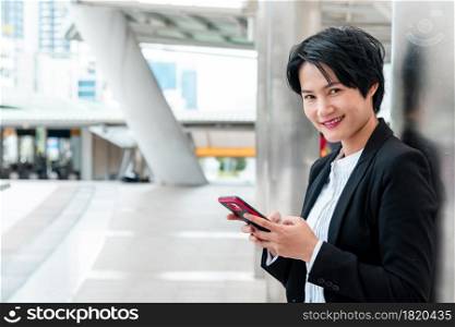 Business woman using smartphone shopping online, call, texting message internet technology lifestyle. Asian woman using cellphone walking on city street. Smart phone smart confident woman modern city