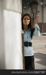 Business woman walking around corner, outdoors