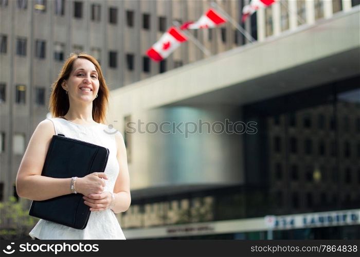Business woman walking downtown in a Canadian city