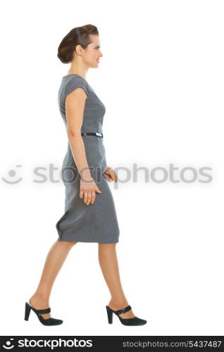 Business woman walking in corner